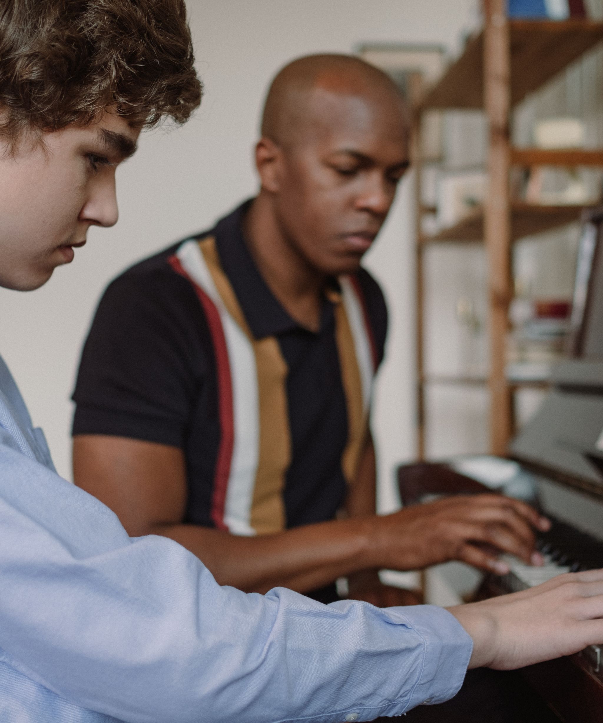 Piano lesson with a teacher and student