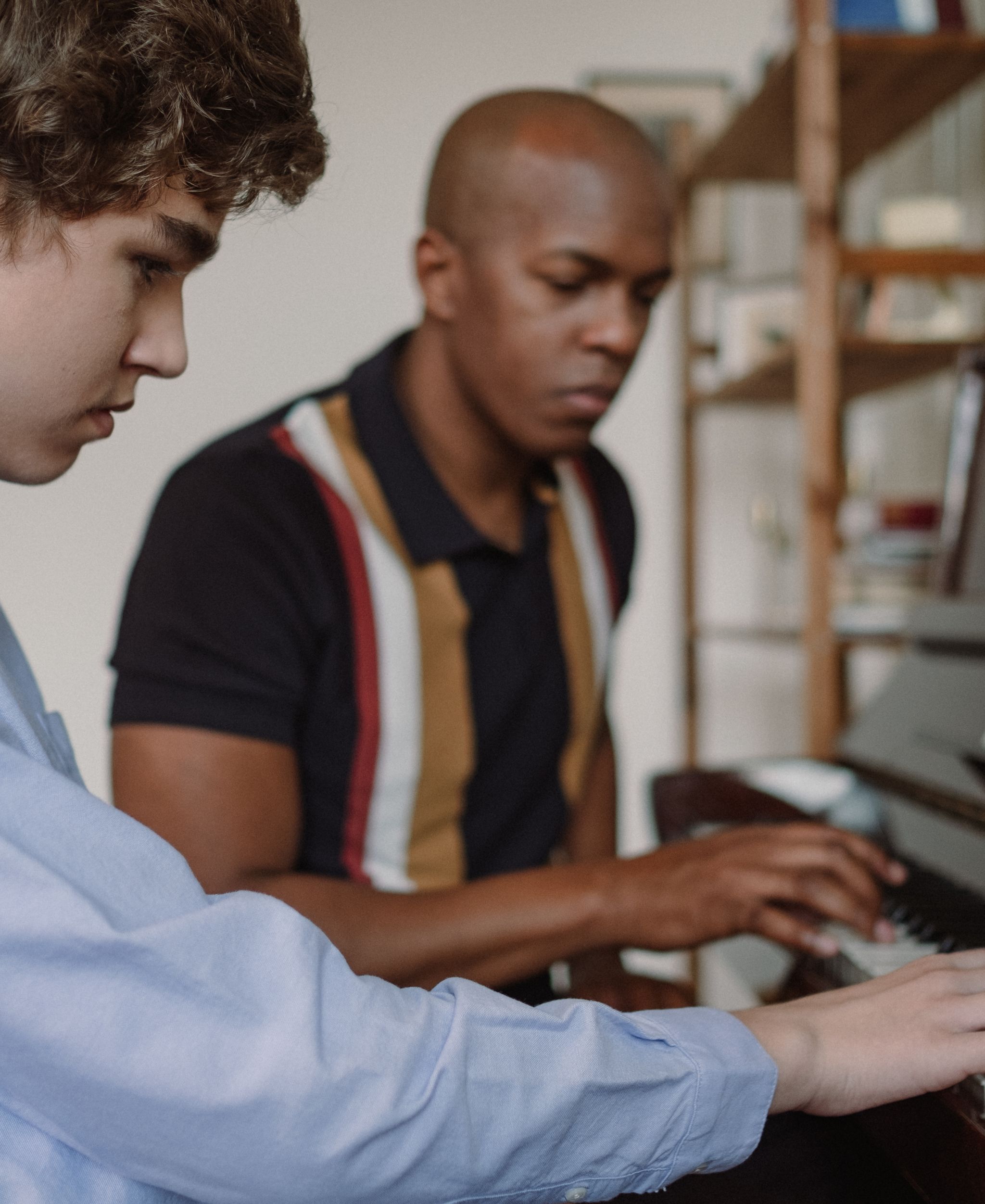Piano lesson with a teacher and student