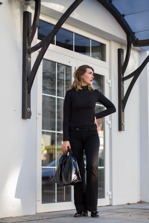 Woman Wearing Black Dress Pants With Black Handbag · Free Stock Photo
