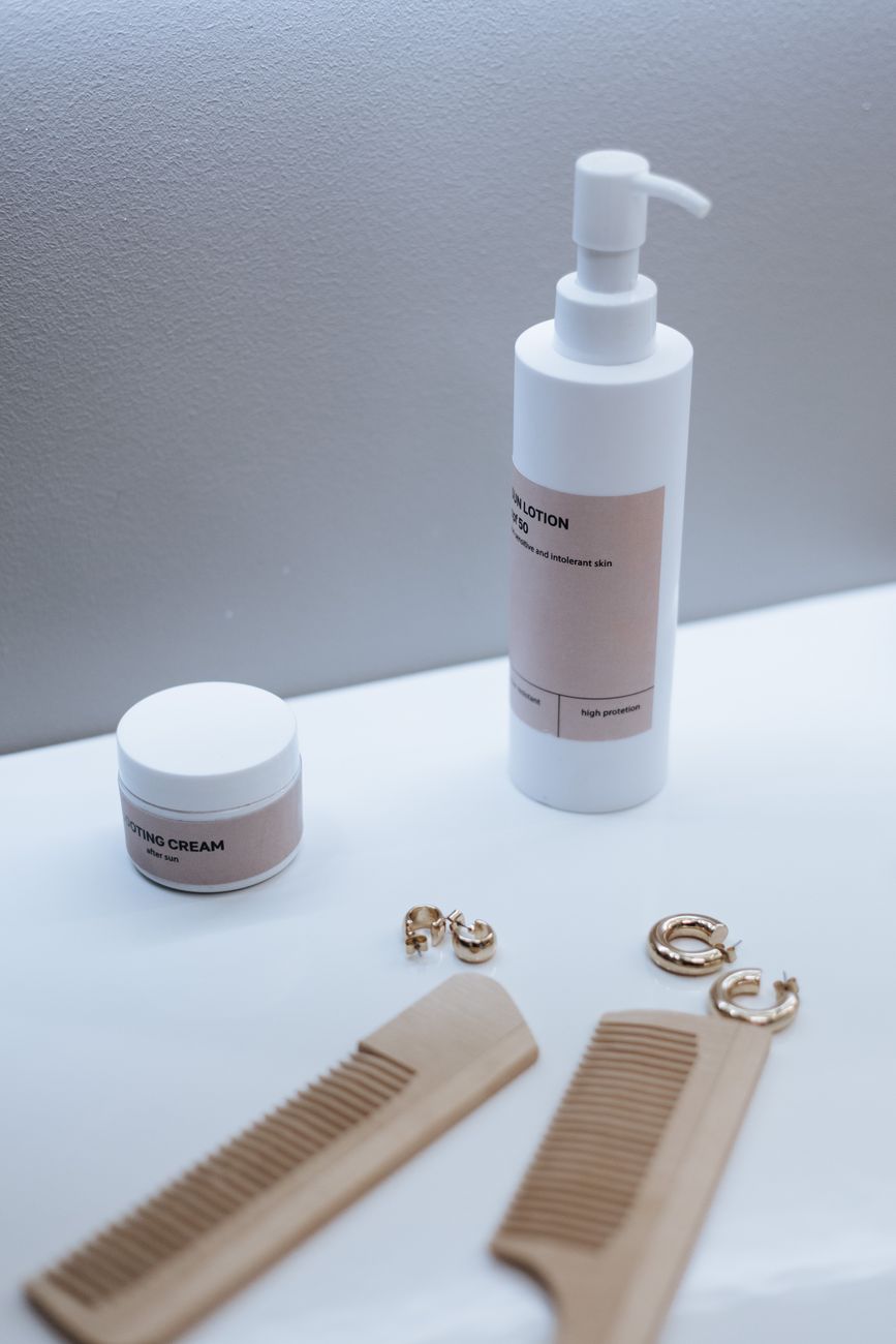 A serene bathroom setting featuring cosmetic products, wooden combs, and jewelry for a luxurious feel.