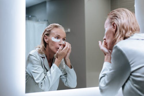 A Senior Adult During Mourning Routine in a Bathroom 