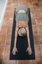High Angle View on Woman Stretching on Mat