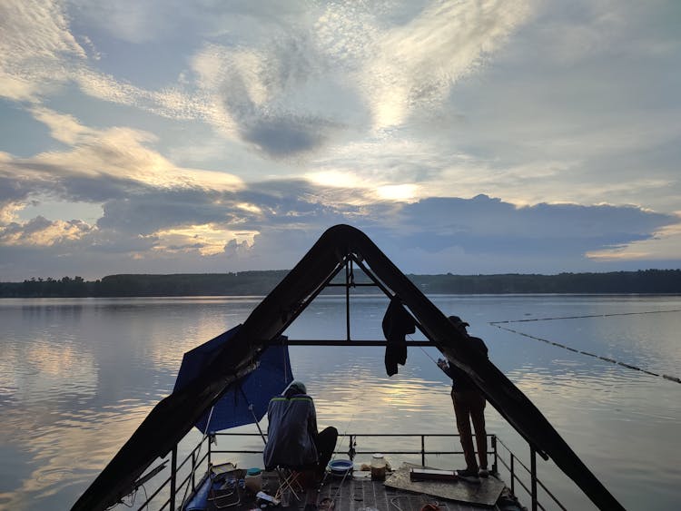 Fishermen On A Messy Watercraft