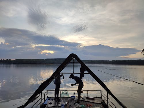 People on a Dirty Watercraft