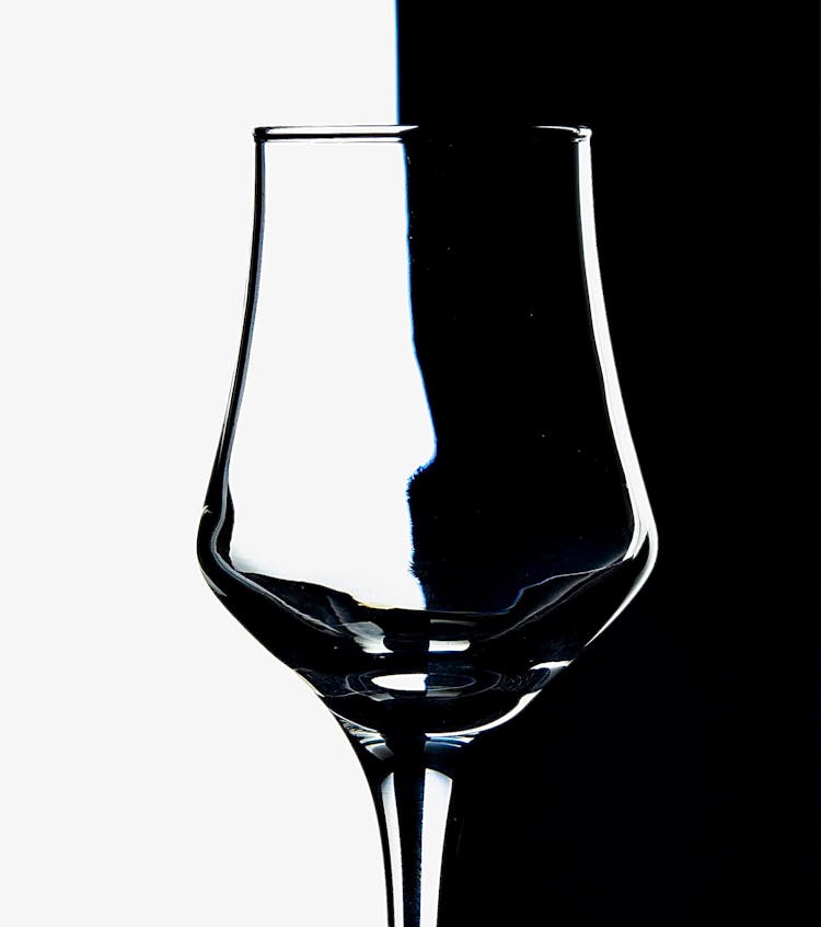 Empty Glass On Black And White Back