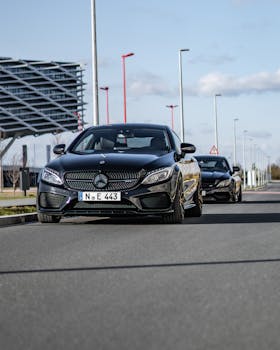 A stylish black Mercedes-Benz coupe parked on a quiet street in Nürnberg, Germany.