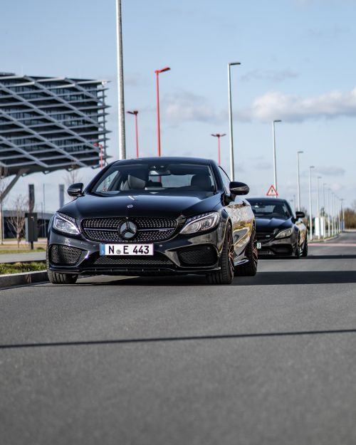 Free A stylish black Mercedes-Benz coupe parked on a quiet street in Nürnberg, Germany. Stock Photo