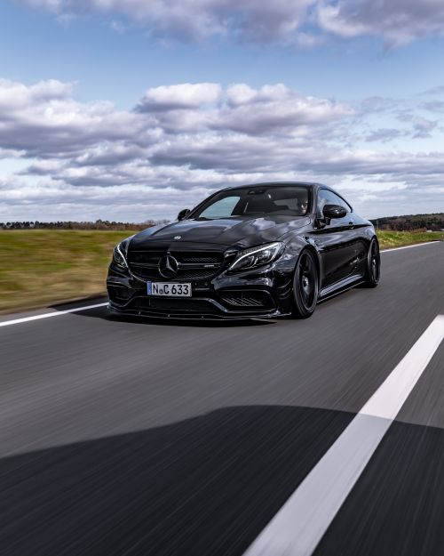 Free High-speed black Mercedes Benz cruising on a clear highway in Nürnberg, Germany. Stock Photo