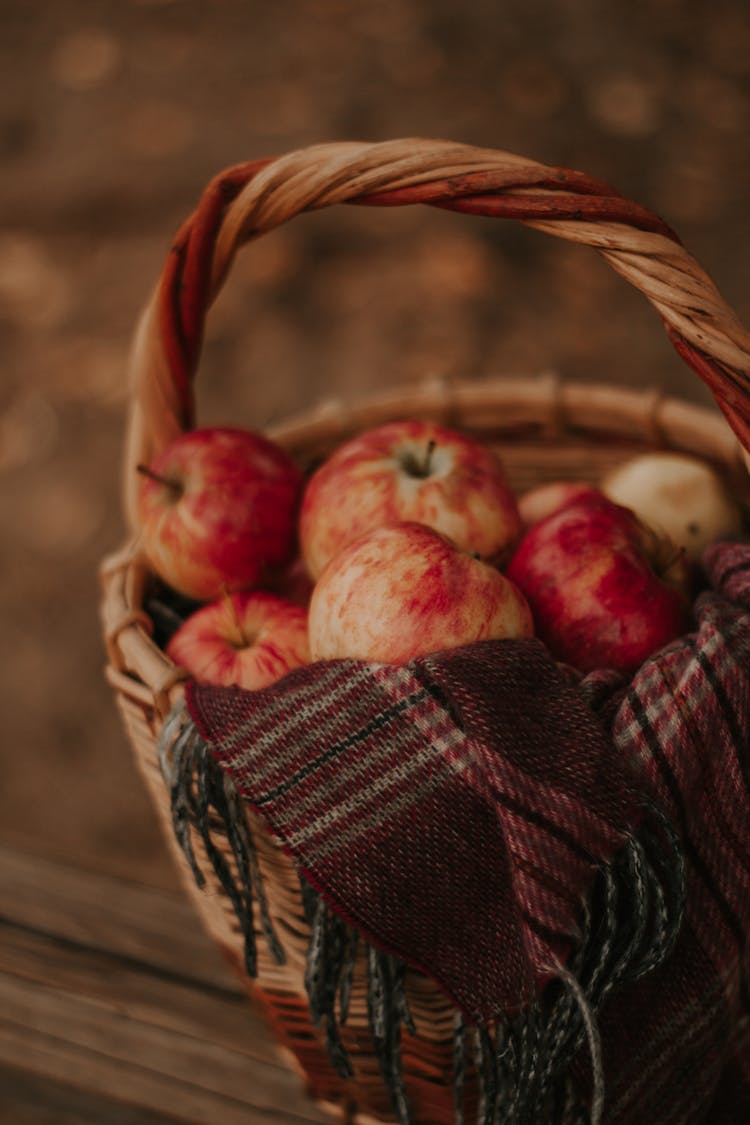 A Selective Focus On Apples In A Basket 