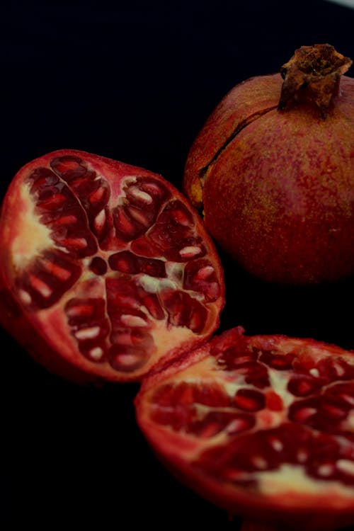 Free Red Round Fruit on Black Background Stock Photo