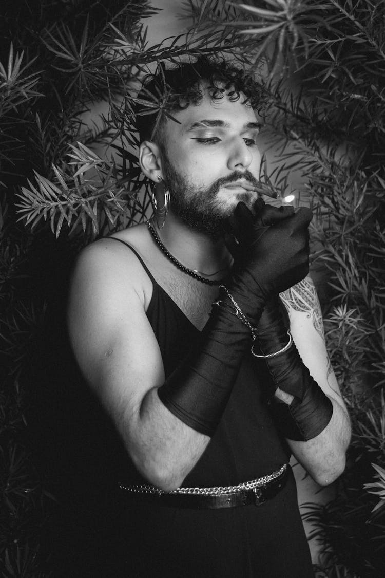 Man In Black Gloves Lighting A Cigarette