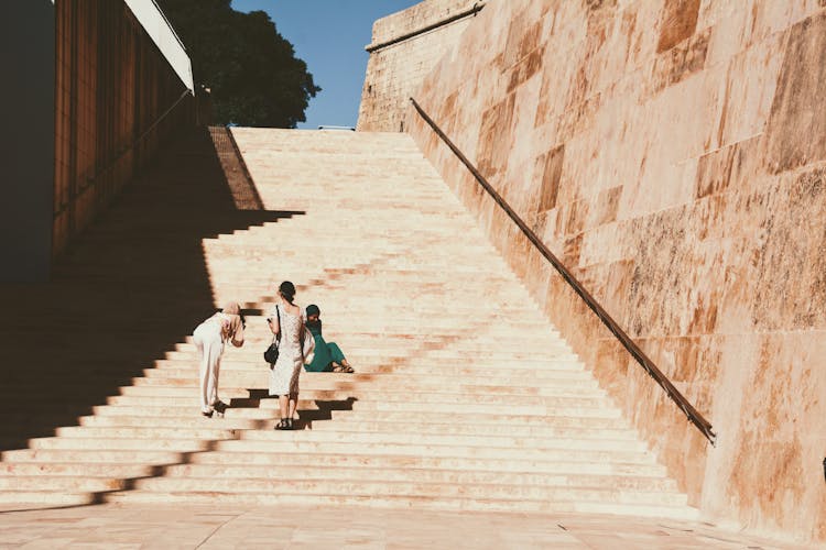 Women Taking Pictures At The Stairs