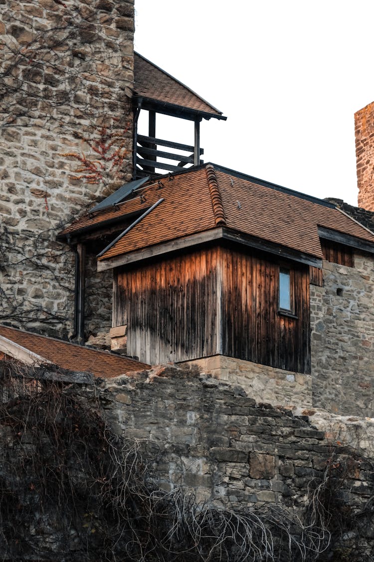 Wooden Shed And Medieval Wall