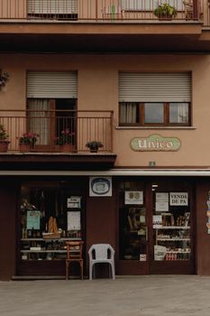A quaint urban storefront with balconies and rustic charm, perfect for lifestyle imagery.