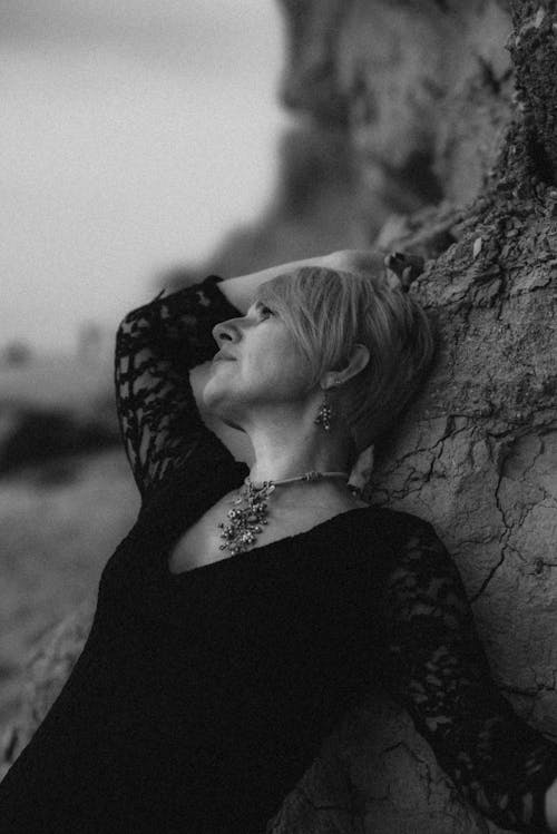 Black and White Photograph of a Woman with a Necklace