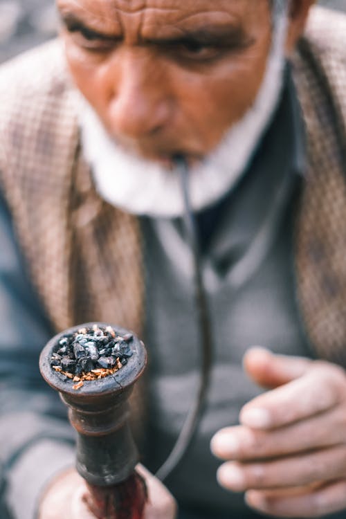 Free Elderly Man Smoking Using a Tobacco Pipe Stock Photo