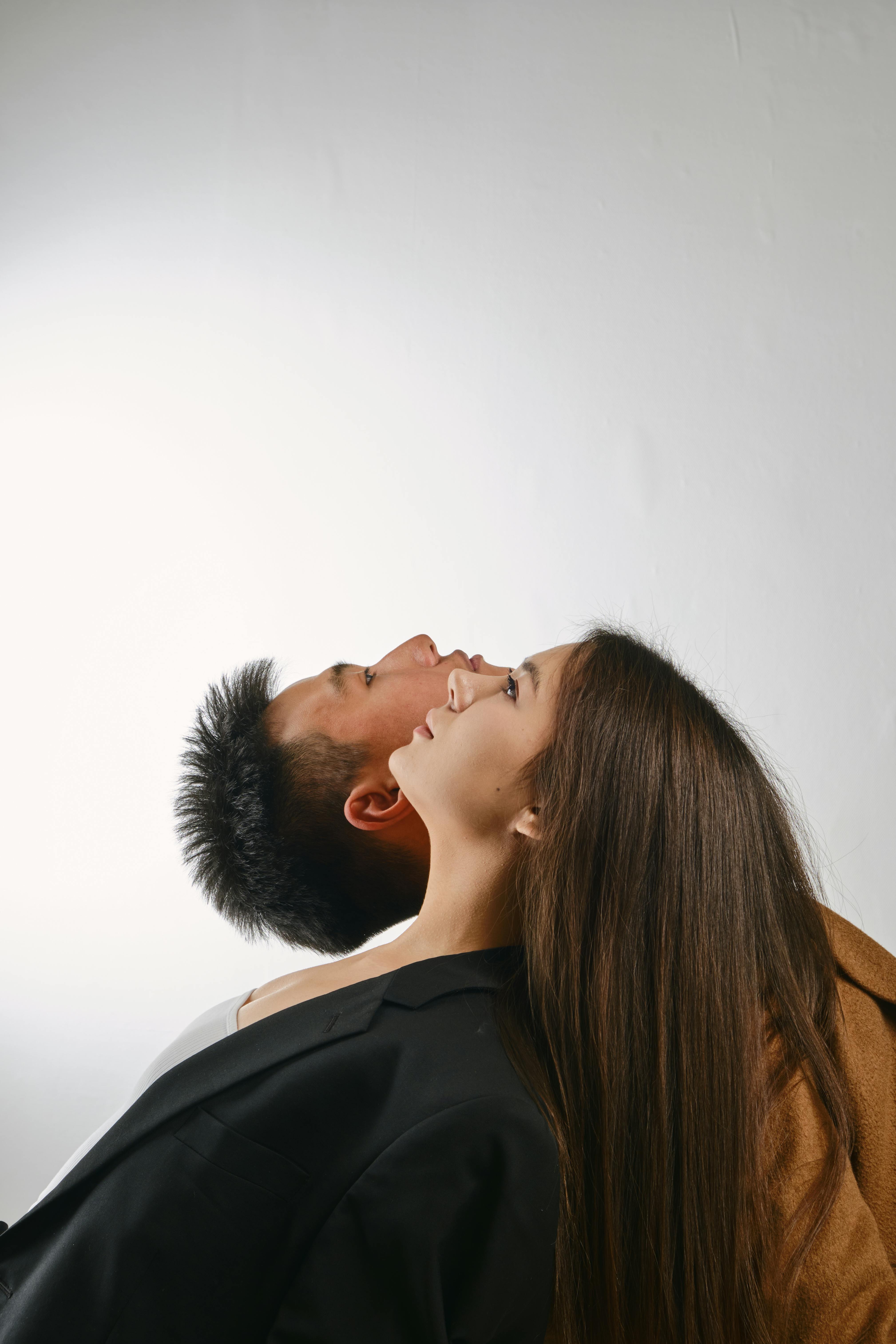 Woman and Man Posing on White Background · Free Stock Photo