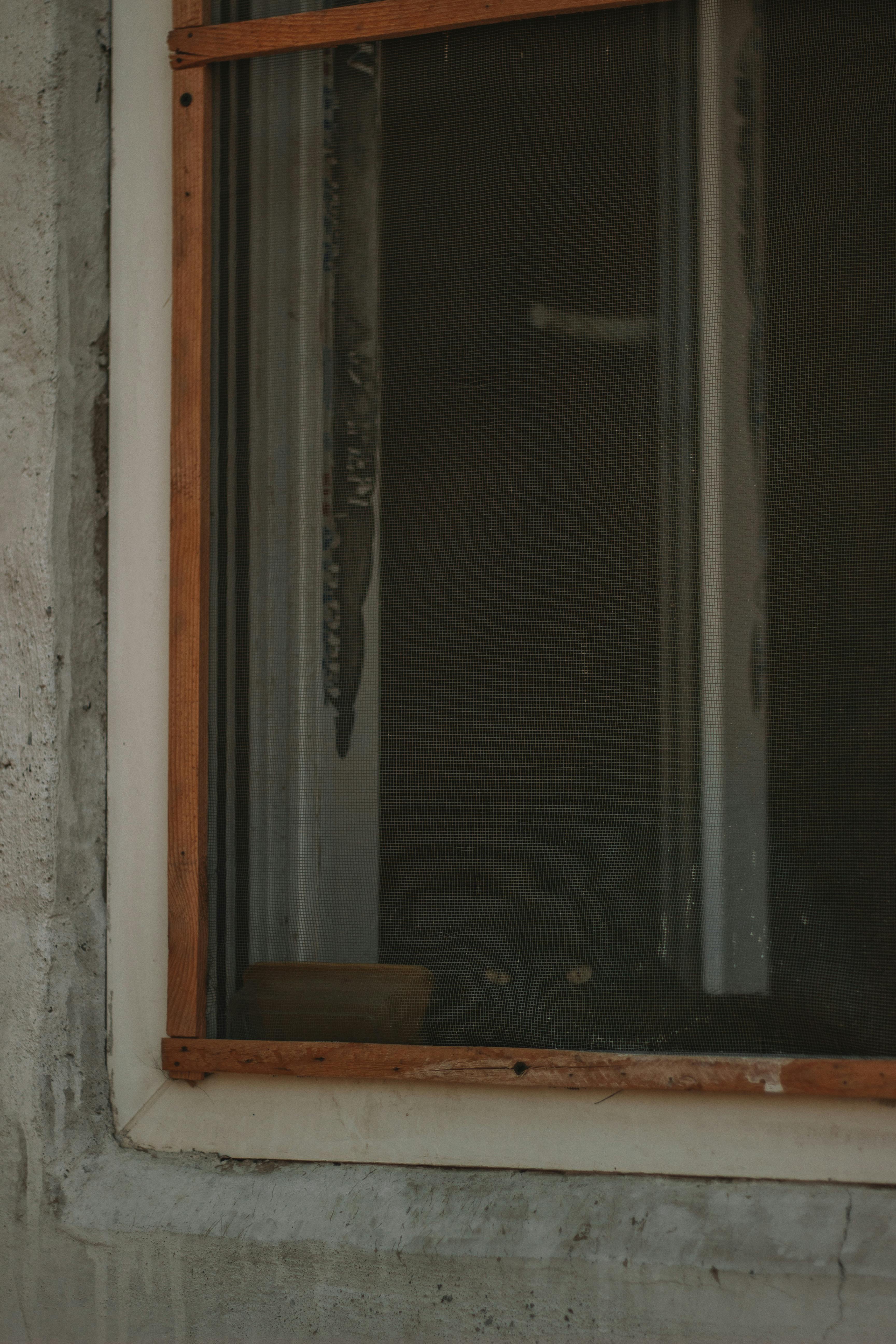 Close-up of a Window with a Wooden Frame · Free Stock Photo