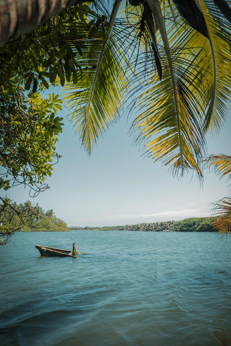 A Wooden Boat Sinking On The River