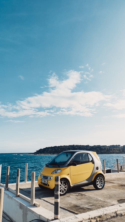 Free An Electric Car Parked Near the Sea Stock Photo