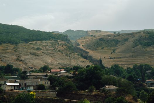 A picturesque view of a small village nestled in the mountains of Dagestan, Russia.