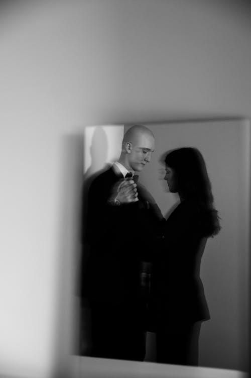 Free Mirror Reflection of a Dancing Couple Stock Photo
