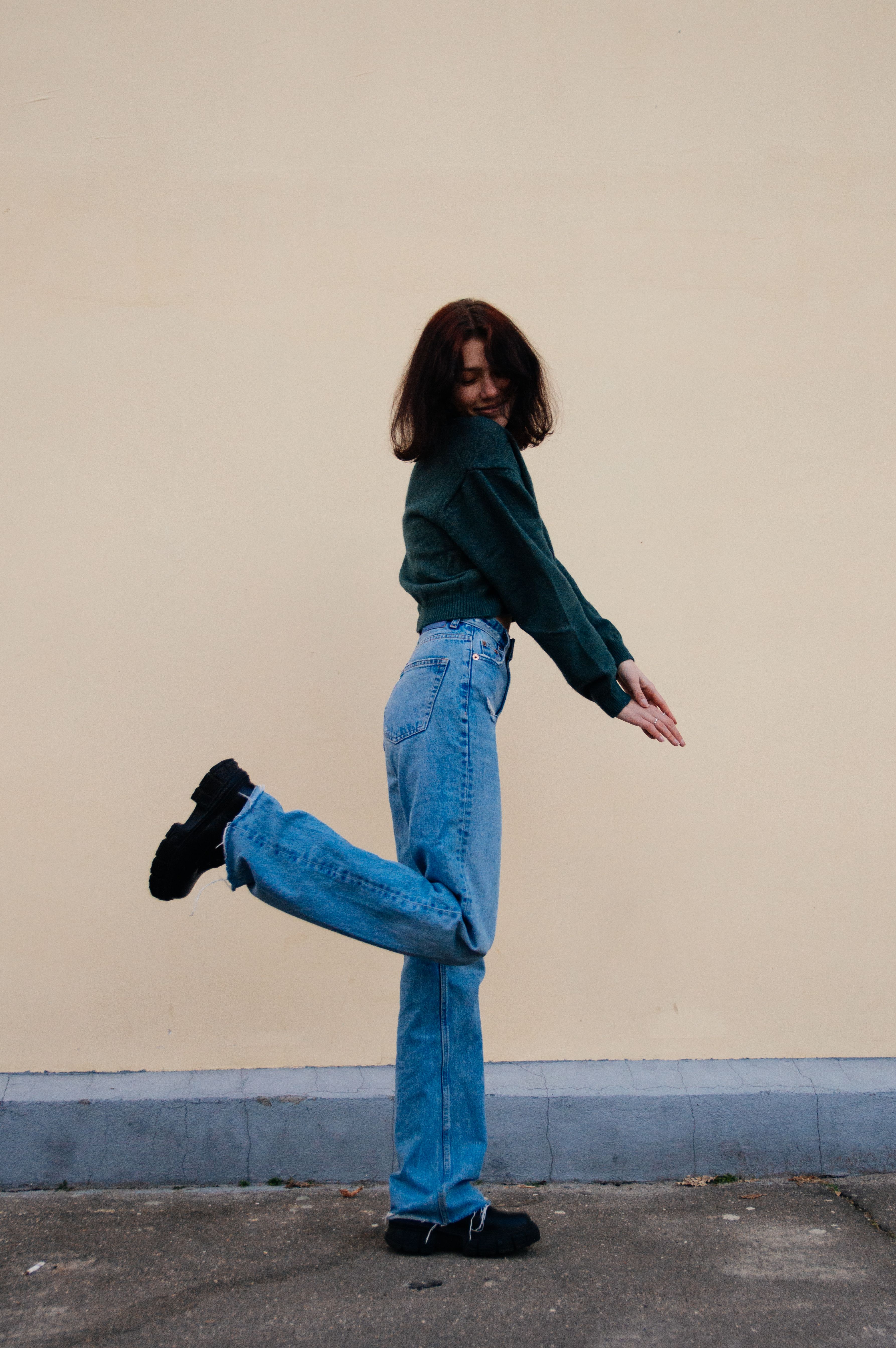 Woman in casual henley-style top and jeans