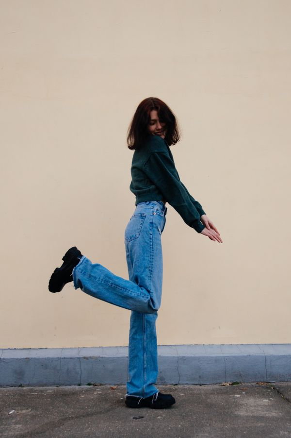 Woman in casual henley-style top and jeans