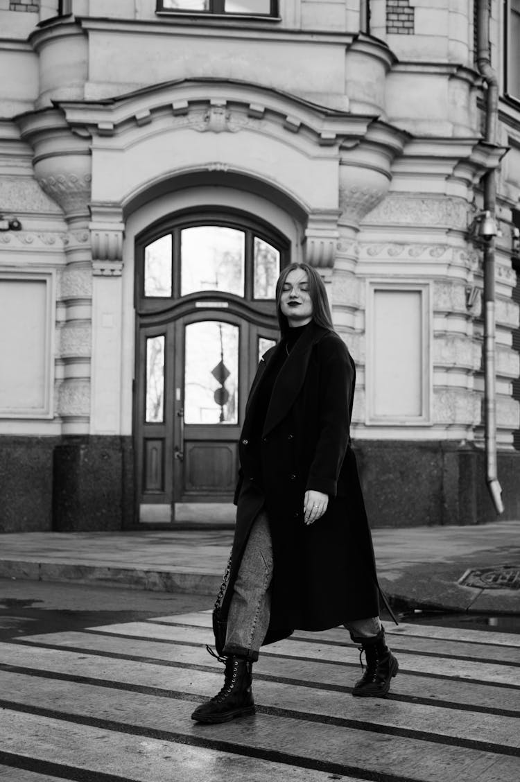 Girl On A Coat Crossing The Street