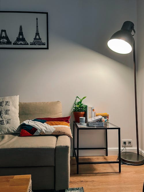 Lamp by Table and Sofa in Apartment