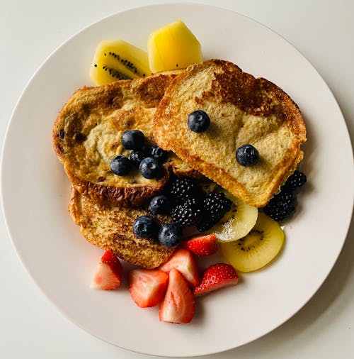 Free A Plate of French Toast With Sliced Fruits  Stock Photo