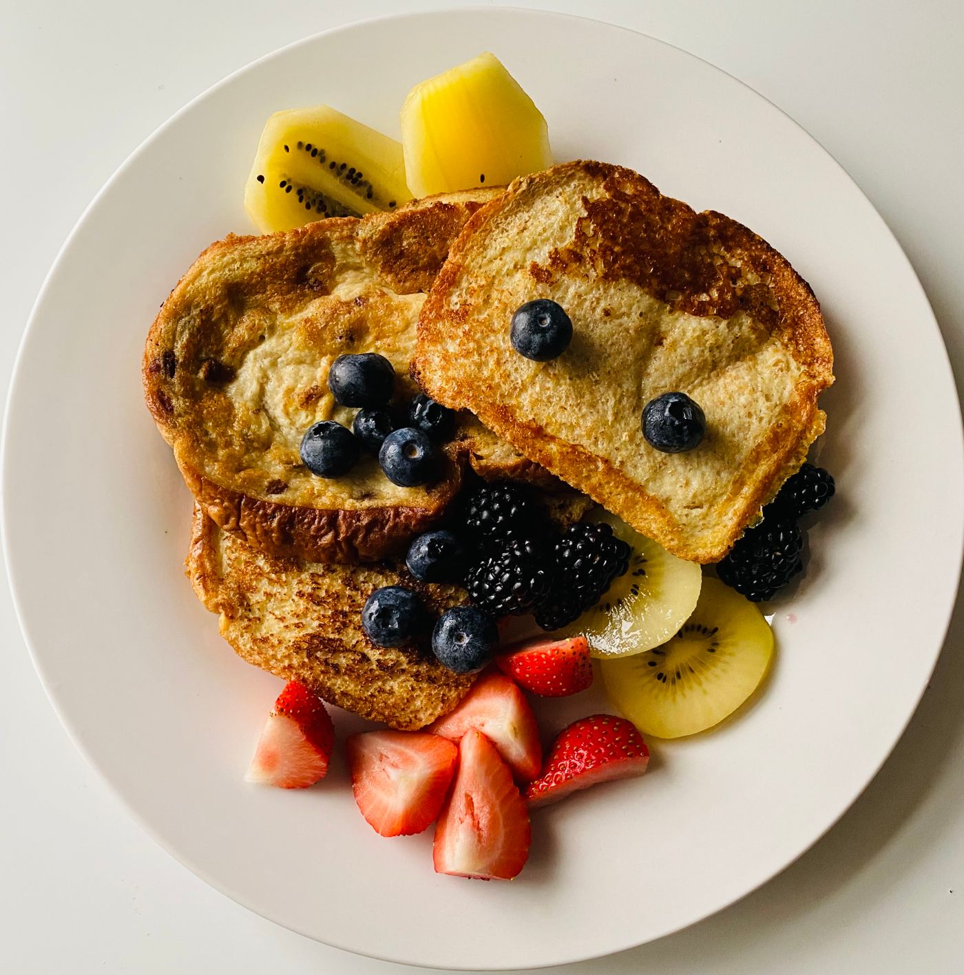Golden French toast served with fresh fruit