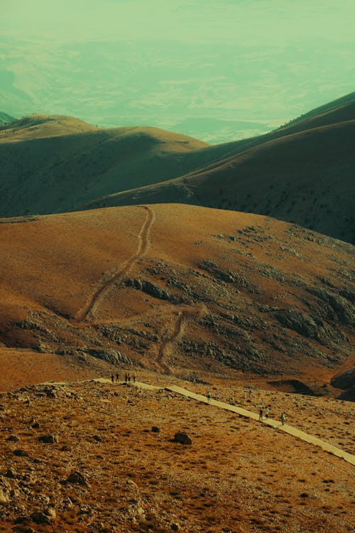 Drone Shot of People Walking on the Hill