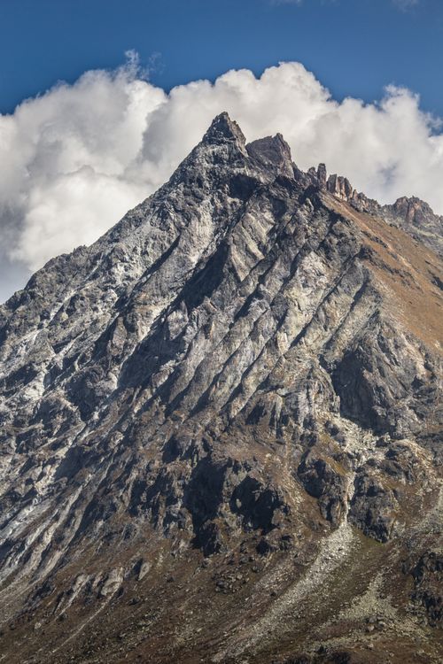 Free Breathtaking view of a rugged Swiss mountain peak under a blue sky, perfect for nature enthusiasts. Stock Photo