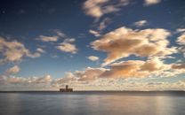 Body of Water Under Blue Sky and White Clouds