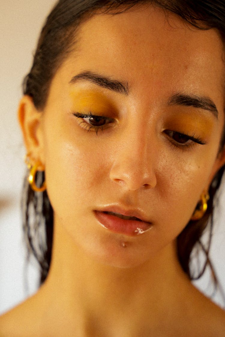 Woman Wearing Gold Hoop Earrings