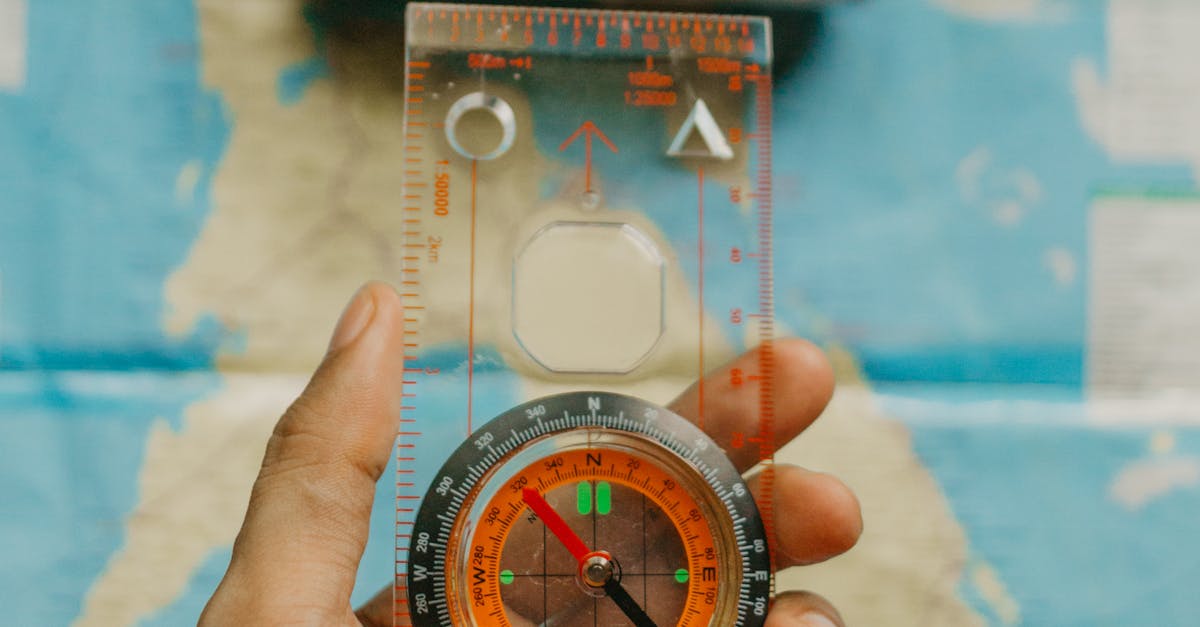 Person Holding a Compass · Free Stock Photo