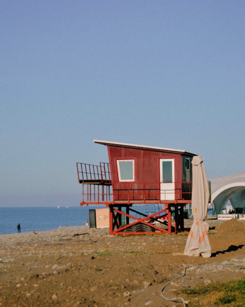Free Red Lifeguard Tower at the Beach   Stock Photo