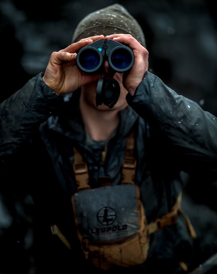 Man Looking Through Binoculars