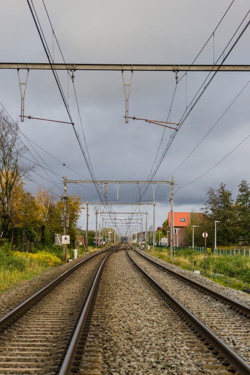 Free Railroad Under Cloudy Sky Stock Photo