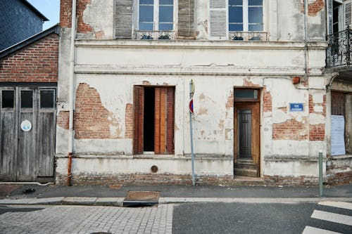 Open Door and Window of an Old Building