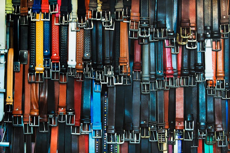 Shallow Focus Photography Of Assorted-color Leather Belts