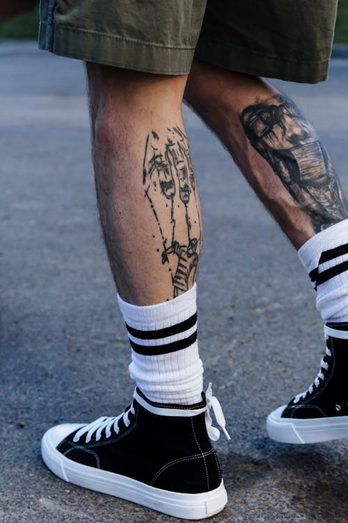 Free Tattooed Legs of Man  Stock Photo