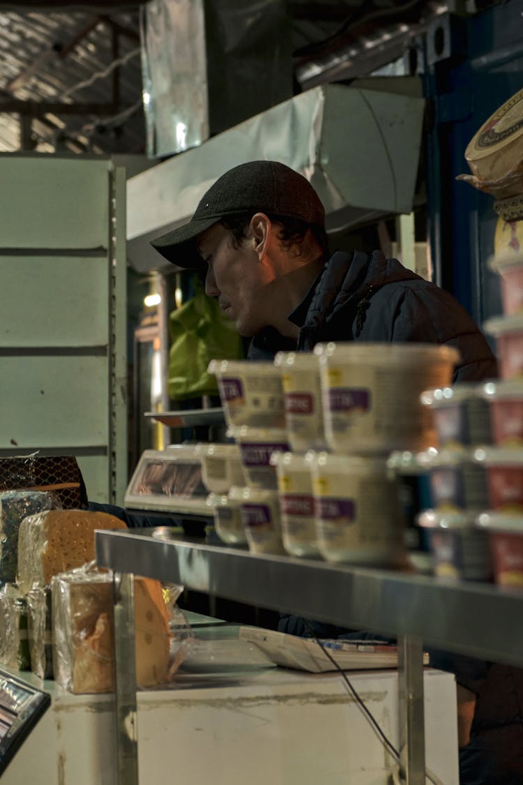 Man Selling Food On A Local Market 