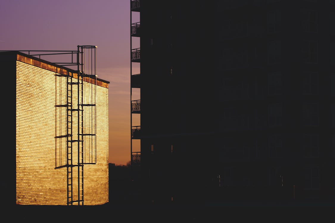 Silhouette of Building during Golden House Photo
