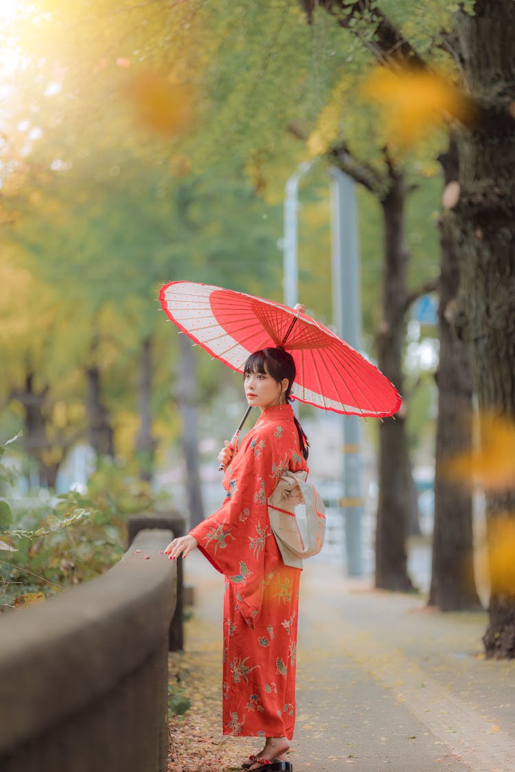 Woman In Kimono Holding Umbrella