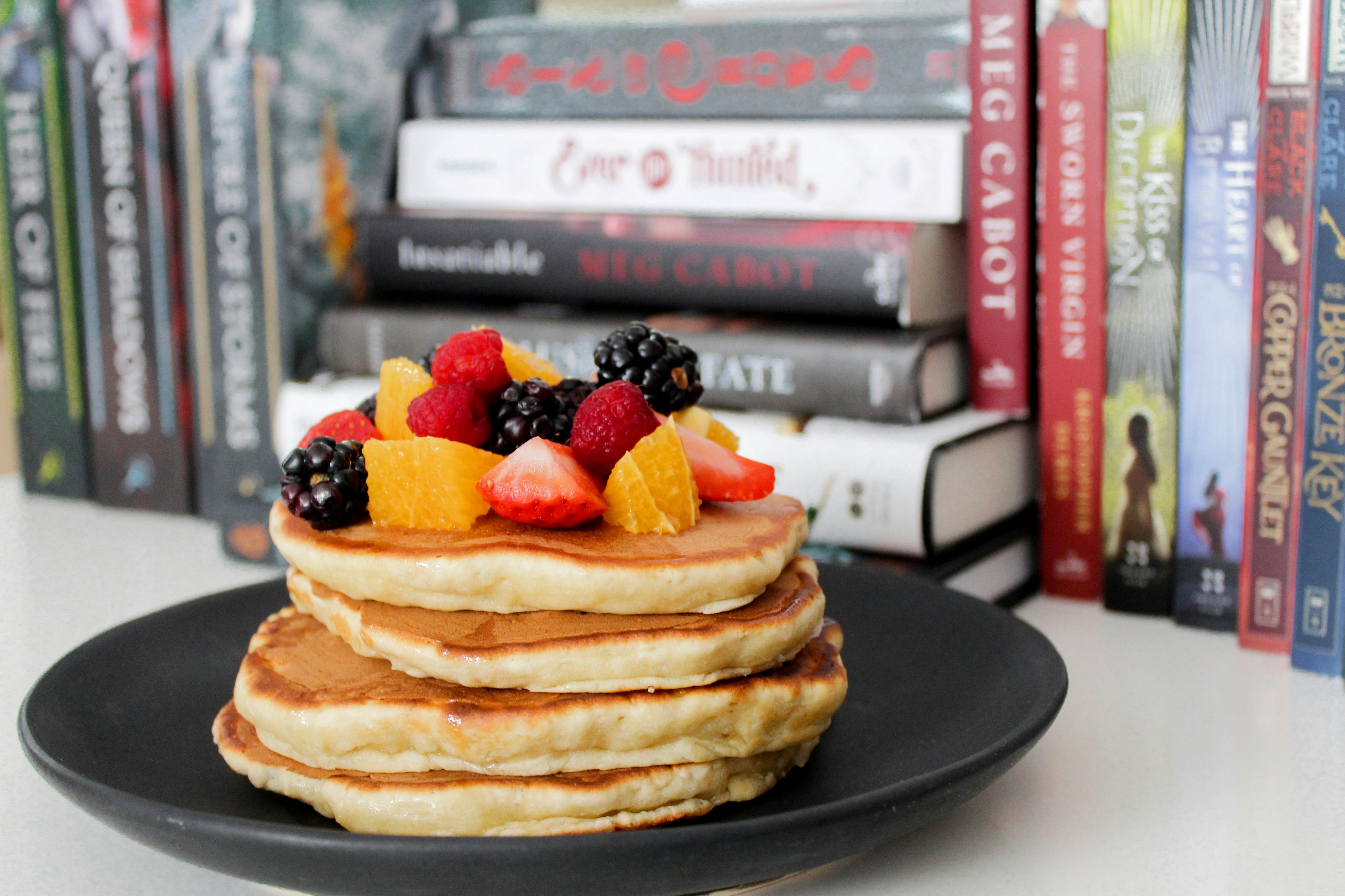 Pancake on Black Plate Near Books \u00b7 Free Stock Photo