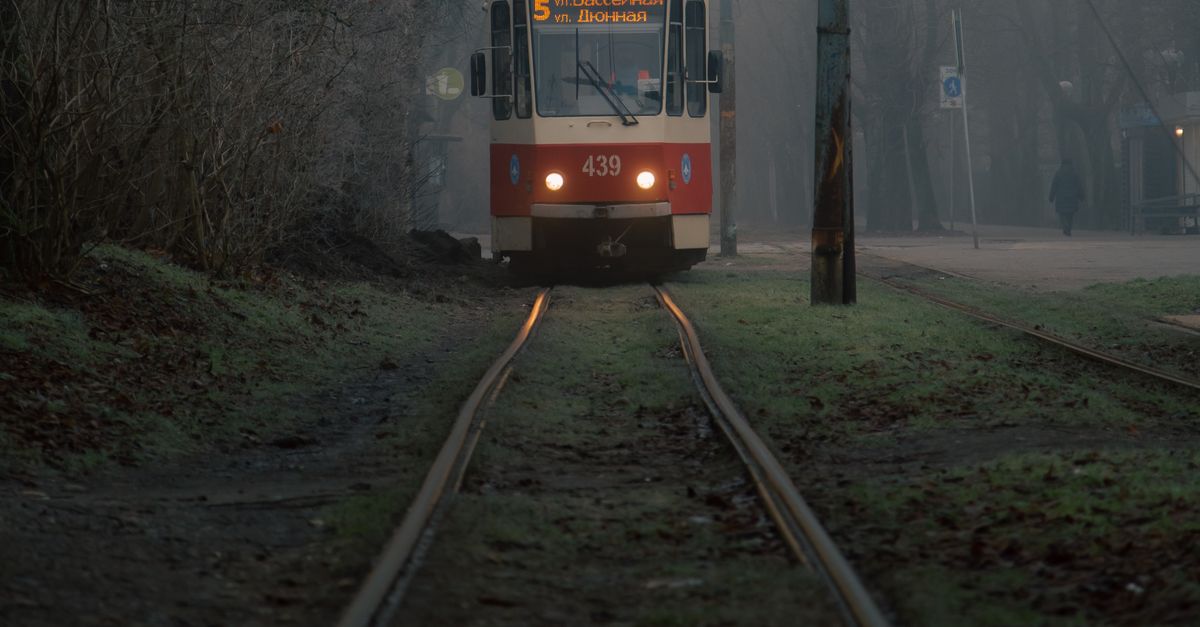 A Train Traveling on Rail Track · Free Stock Photo
