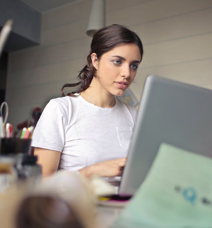 Free Photography of a Woman Using Laptop Stock Photo