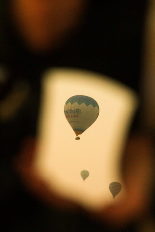 Selective Focus Photo of a Flying Hot Air Balloon